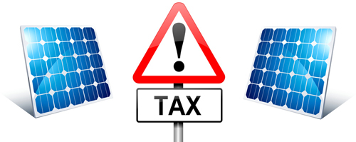 a tax sign and 2 solar panels