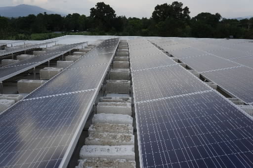 Solar power system with ballasted tilt racks