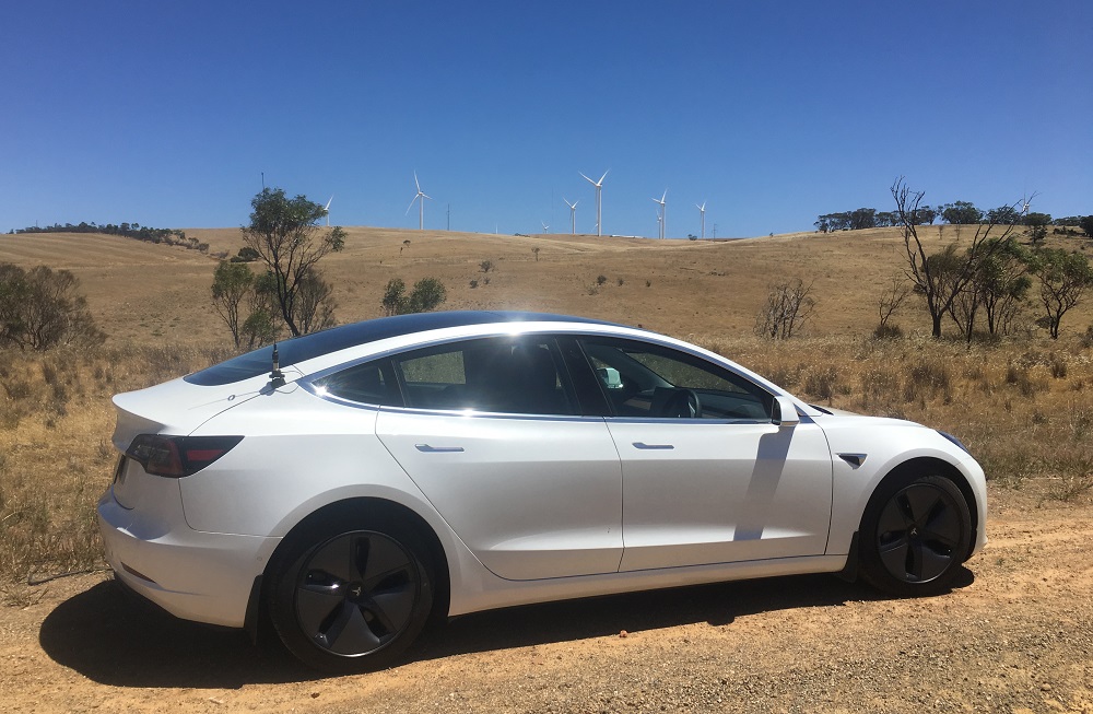 Tesla Model 3 and wind turbines