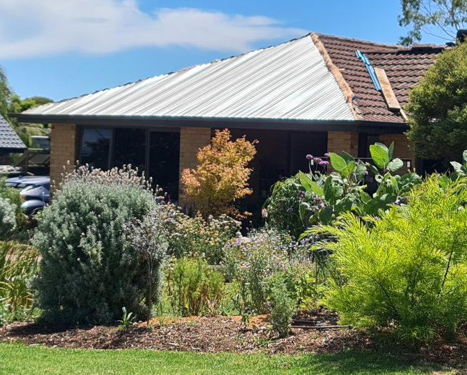 Tiles replaced with metal roof