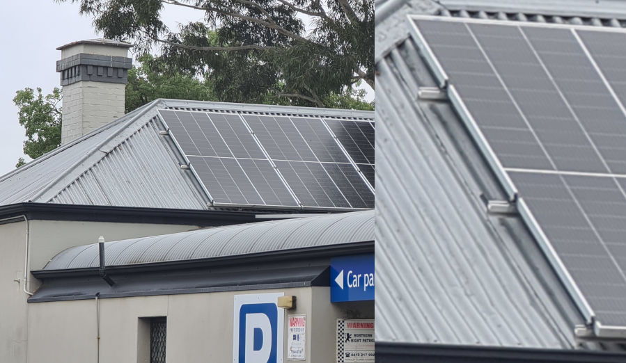 large solar panels on a small building