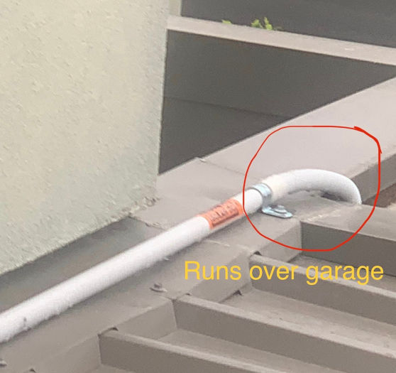 Conduit carrying DC cable over a roof