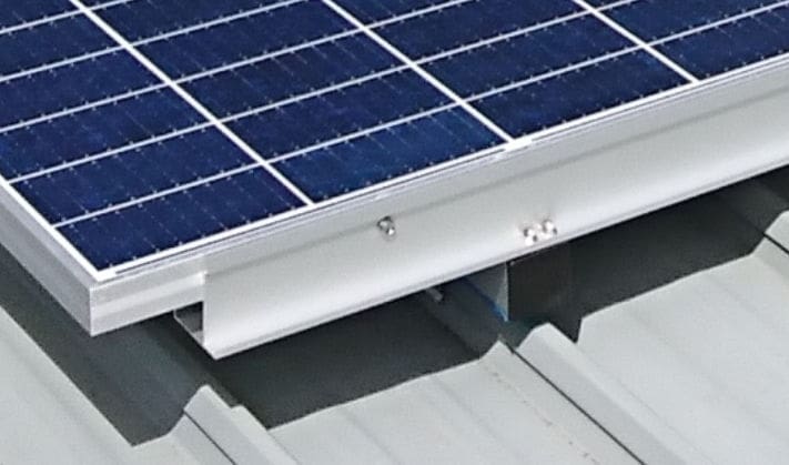 screws into a solar panel