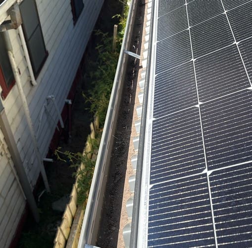 Solar panel gutter placing