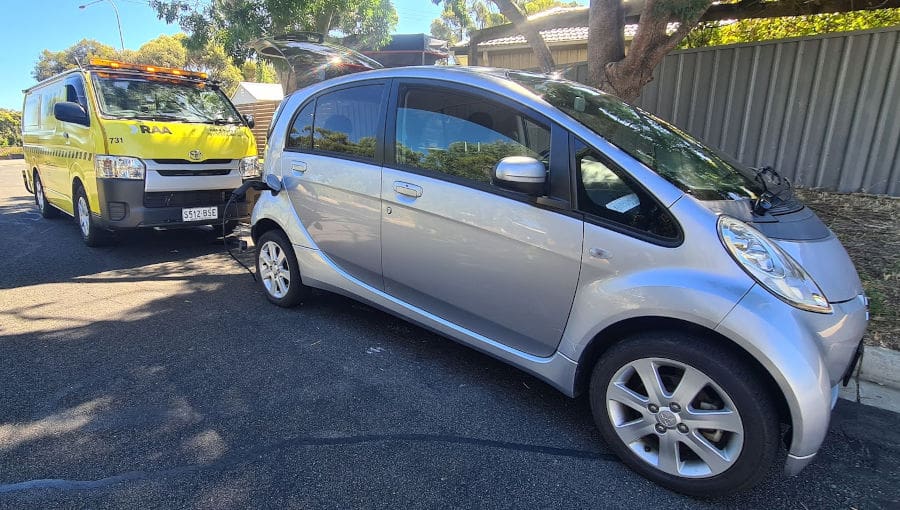 electric car with road service van