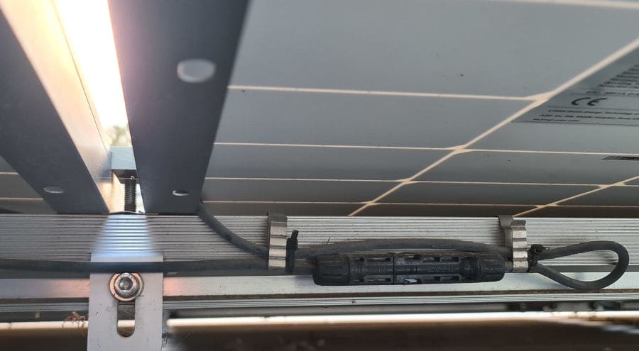 Wiring under a solar panel