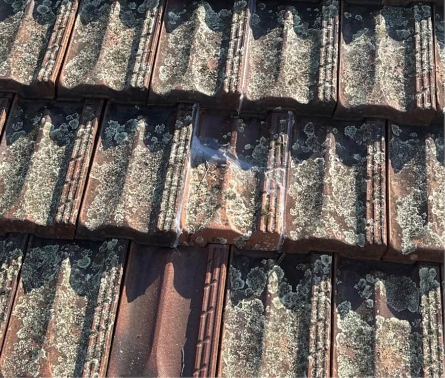 Broken roof tile fixed with silicone.