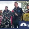 Chris Bowen campaigns during the election in front of signs promoting solar