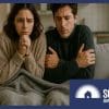 An Australian couple huddled under a blanket in their rental home