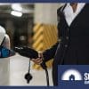 A woman charging an EV