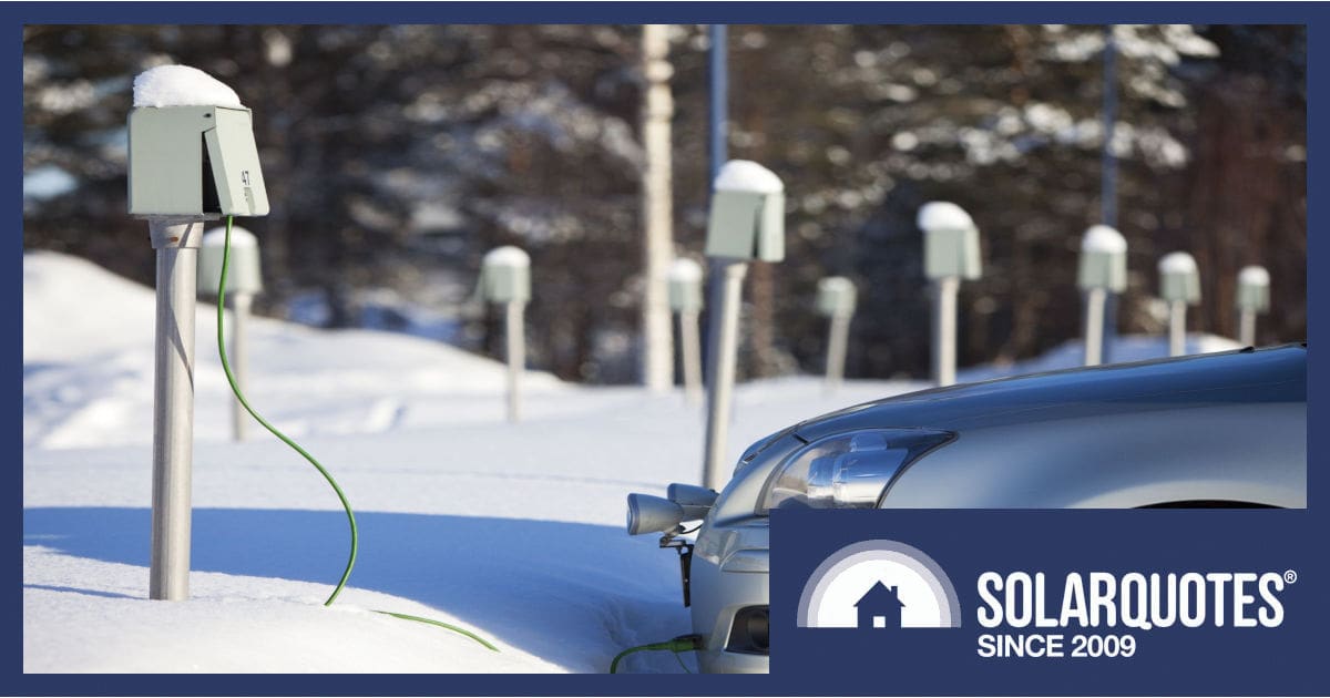 A car charging in snow