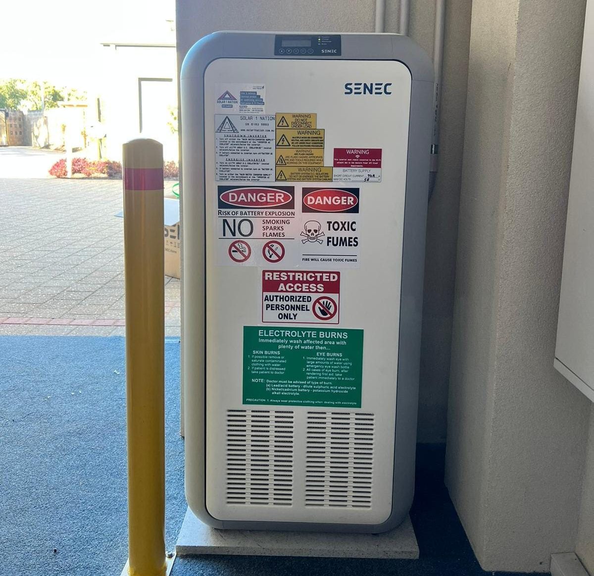 A battery loaded with warning stickers