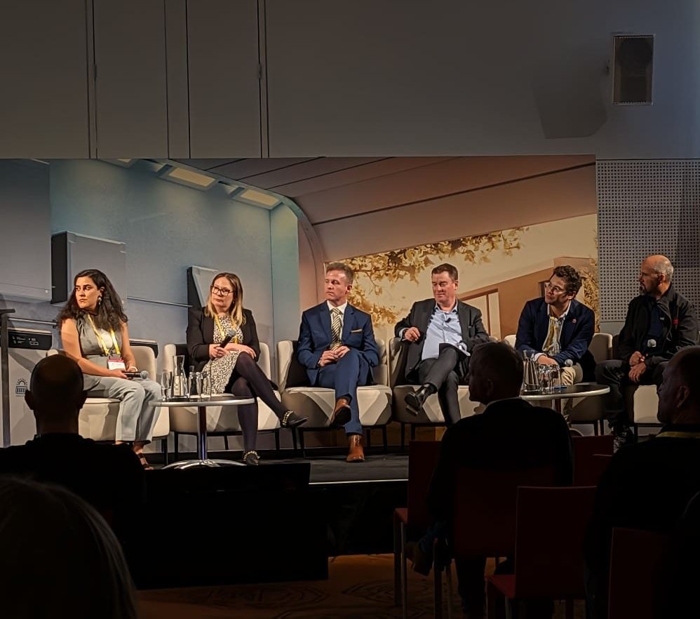 A lineup of speakers at a conference.