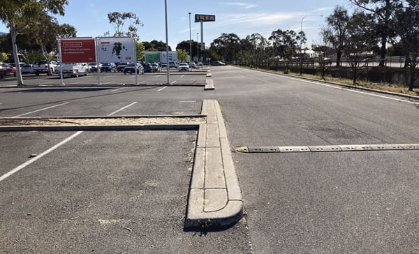 A concrete car park divider.