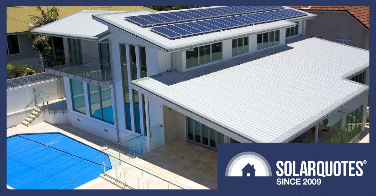 A pool next to solar panels