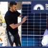 Man showing woman solar panel.