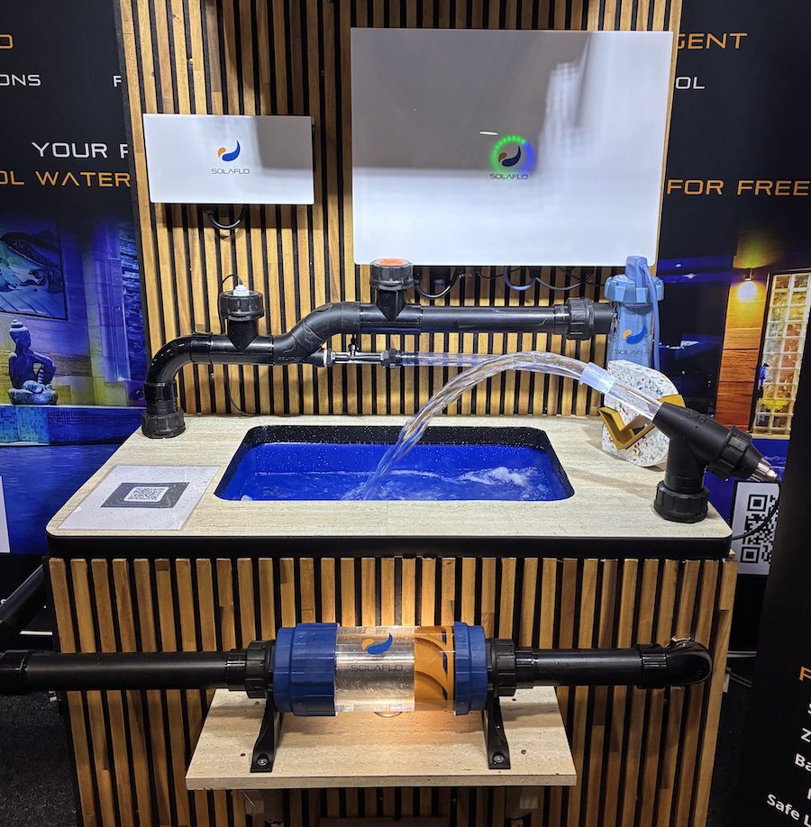 A Solar Flow pool pump demonstration with water flowing into a sink.