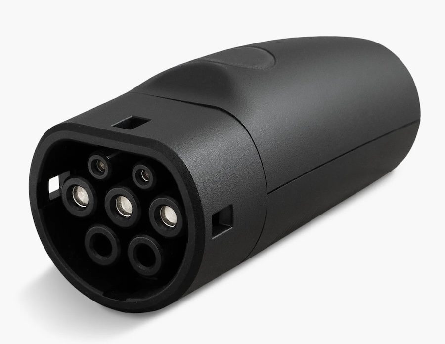 Tesla Outlet Adapter with a charge-port plug on one end.