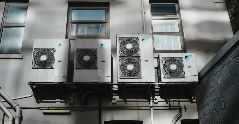 Four different air conditioning compressors.