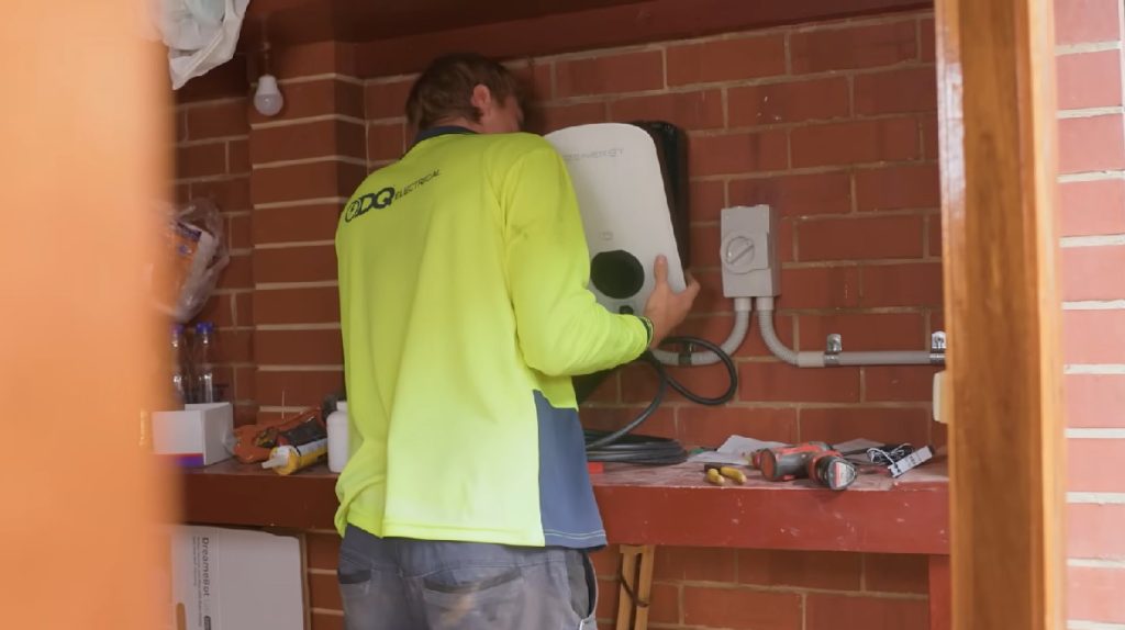 A Sigenergy AC EV charger being installed by DQ Electrical